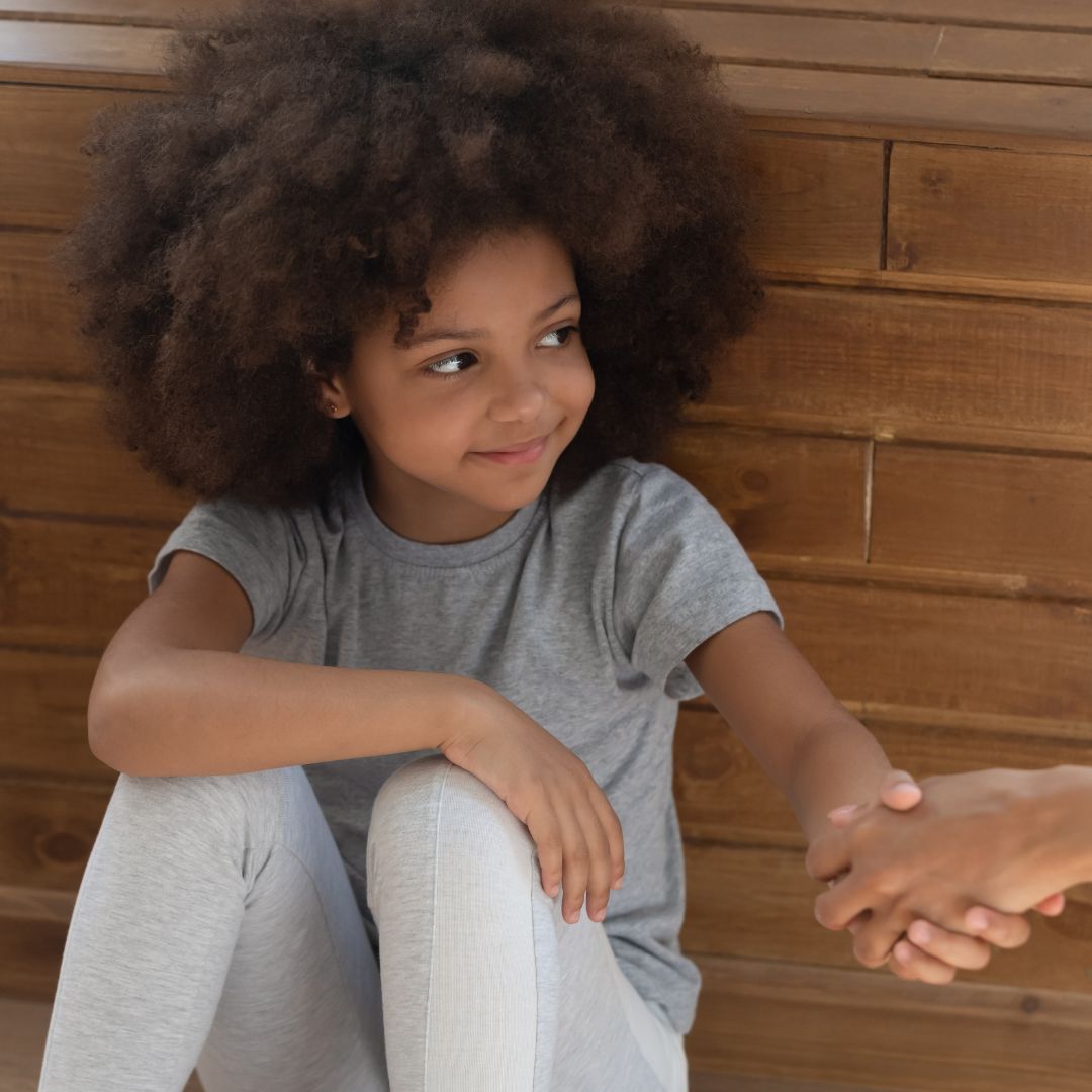 little girl being comforted